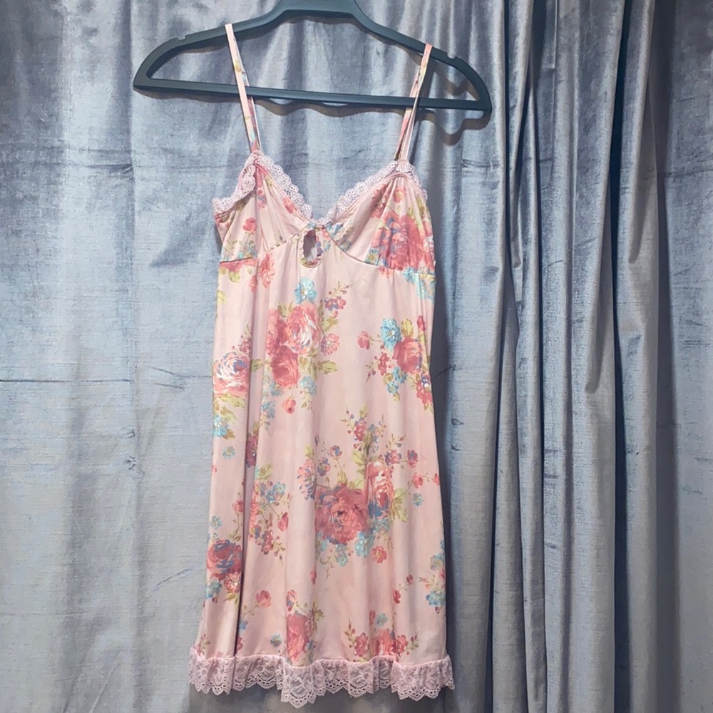 Pink flower dress with lace from Dolls kill. Actual brand is SugarThrills.